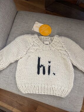 Huggabug Cream Knit Baby Sweater with black “hi.'